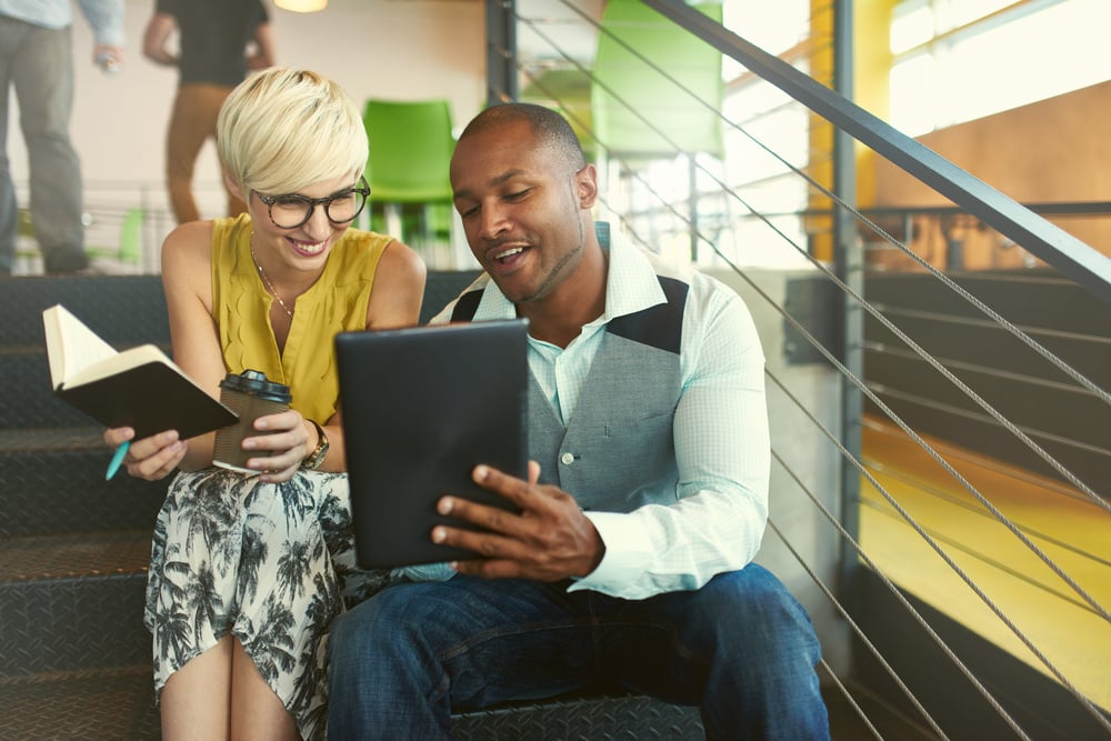 two people reviewing their books